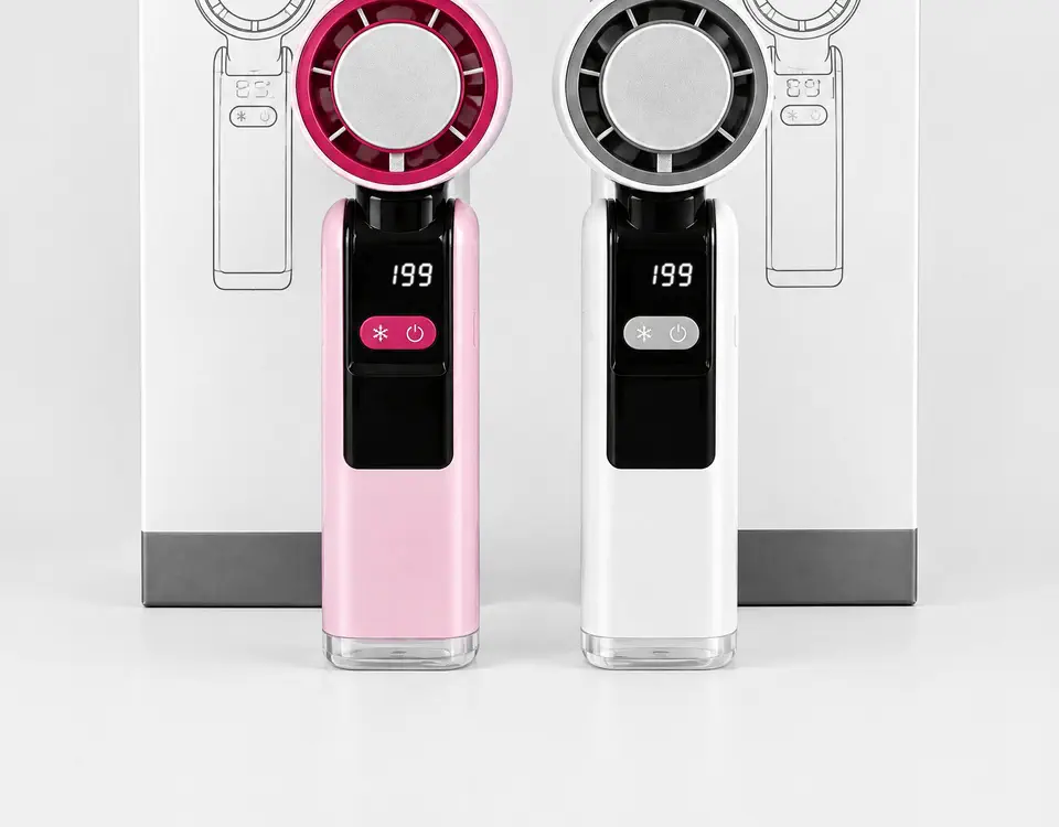 Dos ventiladores Freshlite Turbo, rosa y blanco, con sus cajas